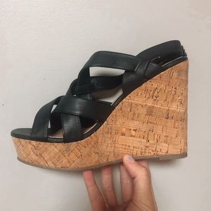Black faux leather wedges